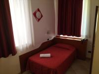 A bed or beds in a room at Hotel Della Volta
