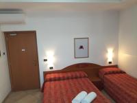A bed or beds in a room at Hotel Della Volta