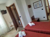 A bed or beds in a room at Hotel Della Volta