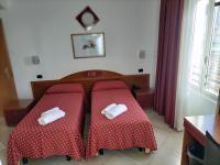 A bed or beds in a room at Hotel Della Volta