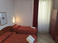 A bed or beds in a room at Hotel Della Volta