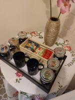 a table with a tray of food and a vase at La Quiétude in Cotignac