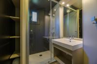 a bathroom with a sink and a shower at Camping U Pirellu in Porto-Vecchio