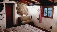 A bed or beds in a room at Casita el Parral