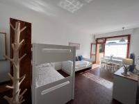Postel nebo postele na pokoji v ubytování Residence Casa Pineta
