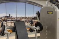 a gym with a view of a city at Residence Inn by Marriott Paris Didot Montparnasse in Paris