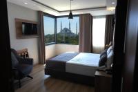 a bedroom with a bed and a window with a view at World Heritage Center Hotel in Istanbul