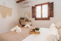 Postel nebo postele na pokoji v ubytování tuGuest Nazarí Calderería Apartments - Free parking