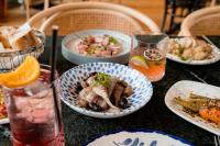 Una mesa cubierta con platos de comida y bebidas. en Le Saint Gervais Hotel & Spa Handwritten Collection, en Saint-Gervais-les-Bains
