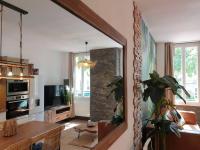 a living room with a table and a large mirror at Bali Dream II Hyper Centre Fontaine Moussue in Salon-de-Provence