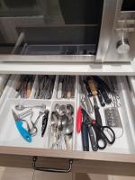 a drawer filled with lots of kitchen utensils at L&#39;appartement Idéal 4 voyageurs in Boulogne-Billancourt