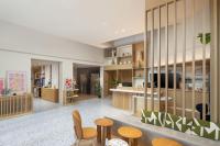 an office with a lobby with tables and chairs at Residence Inn by Marriott Paris Didot Montparnasse in Paris