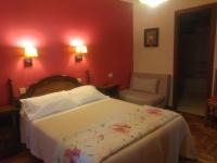 A bed or beds in a room at Hotel Solpor