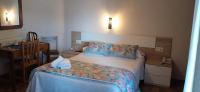 A bed or beds in a room at Hotel Solpor