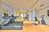 a gym with two treadmills and two exercise bikes at 15 Atelier Montorgueil Super Héros in Paris