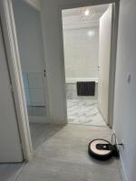 a vacuum laying on the floor in a bathroom at Appartement gare Plaisir grignon in Plaisir