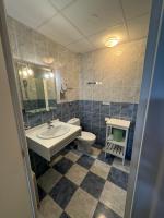 a bathroom with a sink and a toilet at Naéco Erdeven in Erdeven