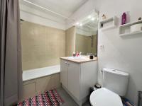a bathroom with a toilet and a sink and a tub at Mon Cocon Occitan - 2p - Wifi &amp; Parking in Colomiers