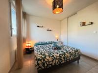 a bedroom with a bed in a room at Mon Cocon Occitan - 2p - Wifi &amp; Parking in Colomiers