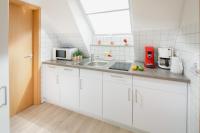Kuchyň nebo kuchyňský kout v ubytování Ferienwohnung Dünenrose
