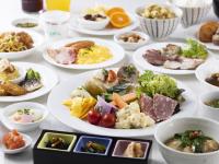 a table with plates of different types of food at Tenza Hotel at Hakata Station in Fukuoka