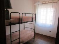 A bed or beds in a room at Appartamenti Budoni