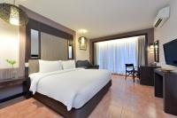 Postel nebo postele na pokoji v ubytování Royal View Resort - Rang Nam