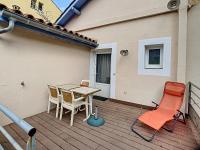Posedenie v ubytovaní Appartement F2 climatisé avec terrasse et parking, proche des Thermes et du centre - Lamalou les Bains - FR-1-451-164