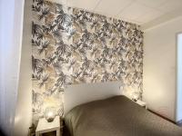 Łóżko lub łóżka w pokoju w obiekcie Appartement F3 avec Terrasse, Proche Centre et Thermes, Animaux Acceptés - Lamalou-les-Bains - FR-1-451-174