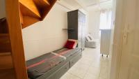 a small room with a bed in a room at A proximité du cinéma et du marché, à 150 m de la plage in La Couarde-sur-Mer