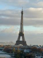 a view of the eiffel tower in a city at Appartement vue Tour Eiffel paris 16 Eme in Paris