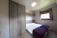 Postel nebo postele na pokoji v ubytování Camping & Bungalows Zumaia