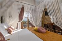Postel nebo postele na pokoji v ubytování Archontiko Fiamegou Hotel&Spa