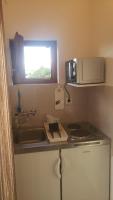 Kuchyňa alebo kuchynka v ubytovaní Apartmani Pilon