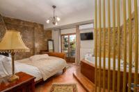 Postel nebo postele na pokoji v ubytování Archontiko Fiamegou Hotel&Spa