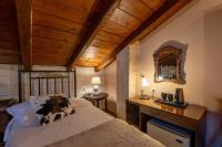 Postel nebo postele na pokoji v ubytování Archontiko Fiamegou Hotel&Spa