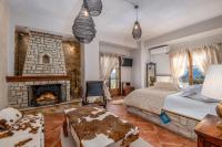 Postel nebo postele na pokoji v ubytování Archontiko Fiamegou Hotel&Spa