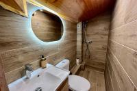 a bathroom with a sink and a toilet at Apartment with balcony and exceptional view in Saint-Gervais-les-Bains