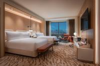 Ein Bett oder Betten in einem Zimmer der Unterkunft Durango Casino &amp; Resort