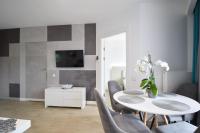 Televízia a/alebo spoločenská miestnosť v ubytovaní Apartament Horyzont 101