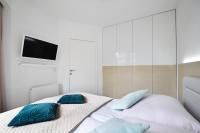 Posteľ alebo postele v izbe v ubytovaní Apartament Horyzont 101