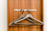 a pair of hangers hanging on a wooden door at 自由之丘民宿 l 寵物友善 in Taitung City
