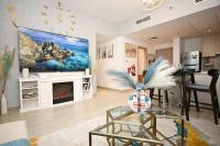 TV a/nebo společenská místnost v ubytování Yas Island 2 BR Turquoise