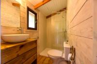 a bathroom with a sink and a toilet and a shower at Camping U Pirellu in Porto-Vecchio