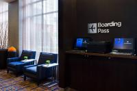 a waiting room with chairs and a desk with a computer at Courtyard by Marriott Birmingham Downtown at UAB in Birmingham