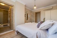 A bed or beds in a room at Gurel Garden House