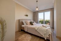A bed or beds in a room at Gurel Garden House