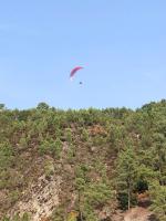 a kite flying in the sky over a mountain at Magnifique appartement 2&#47;4 pers - Le Saint Leo in Saint-Léonard-des-Bois