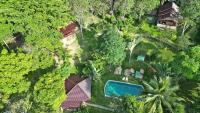 an aerial view of a house with a pool and trees at Banyan Bay Villas in Ko Jum