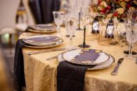 a table with plates and wine glasses on it at THE DREAMS HOTEL in Douala